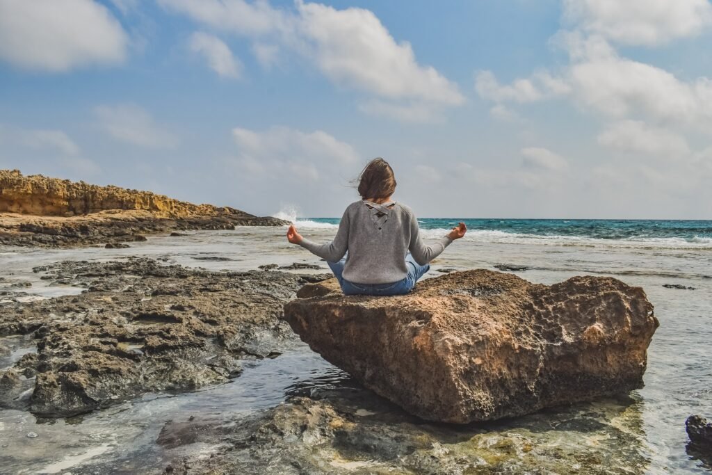 meditate woman on beach sea