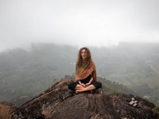 calm woman on mountain meditating