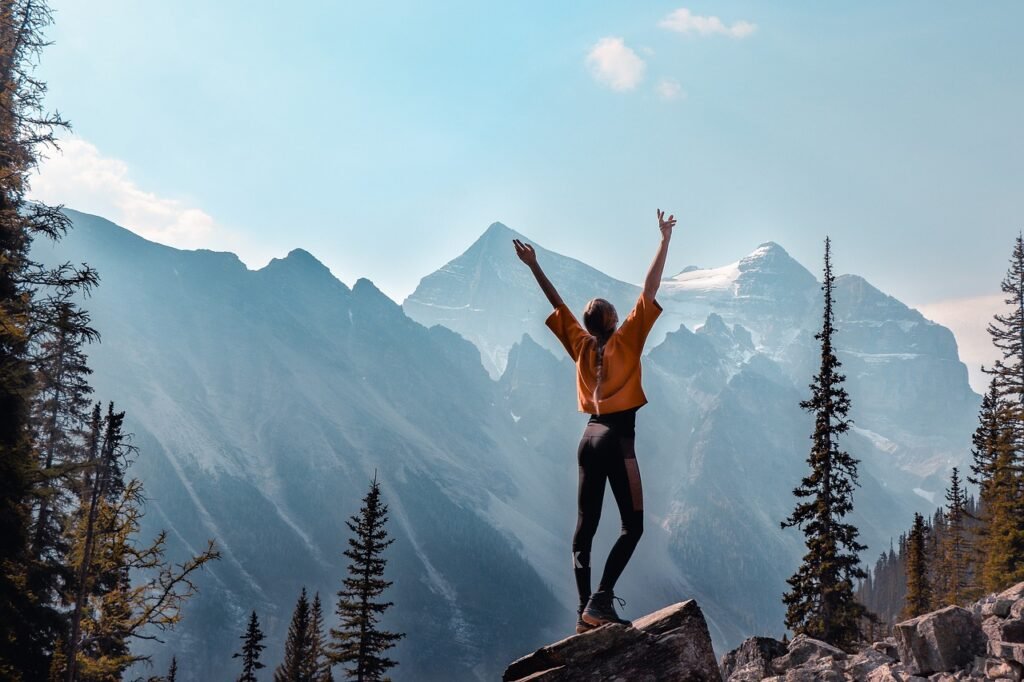 happy Lady on Mountain goal set achieve affirmation